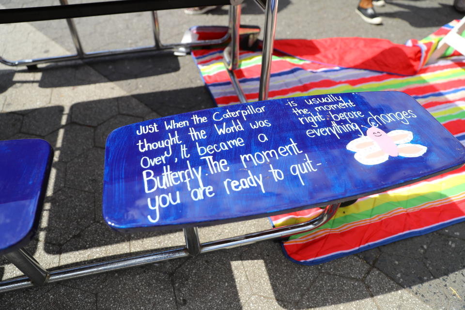 <p>A carefully written message on one of the seats on the table for “Suicide prevention” on display in Union Square Park in New York City on June 5, 2018. (Photo: Gordon Donovan/Yahoo News) </p>