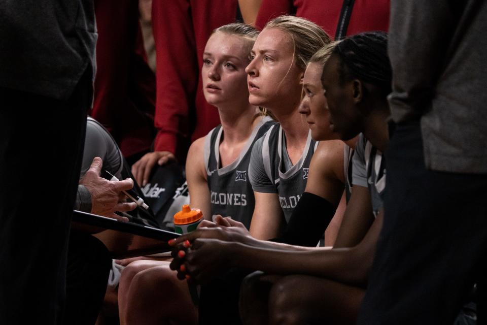 Iowa State point guard Emily Ryan, middle, stayed with the Cyclones even after teammates such as Lexi Donarski, left, left the program.