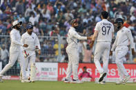 Indian players congratulate teammate Ishant Sharma after he dismissed Bangladesh's Ebadot Hossain during the first day of the second test match between India and Bangladesh, in Kolkata, India, Friday, Nov. 22, 2019. (AP Photo/Bikas Das)