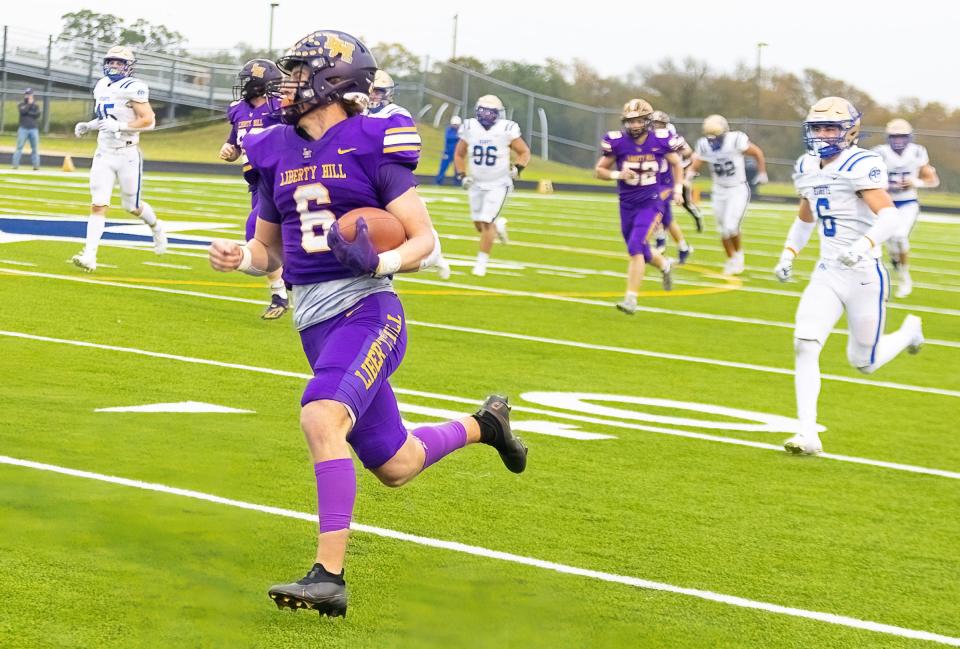 Liberty Hill running back Joe Pitchford leads the way to the end zone against Alamo Heights during the Class 5A Division II playoffs last season. Pitchford's younger brother, Jack, will join the productive backfield as the team's new starting quarterback.