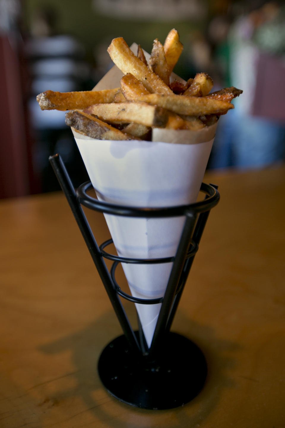 This photo made Friday, July 12, 2013, shows Belgian fries made with local Maine potatoes fried in duck fat, at Duckfat, a small sandwich shop in Portland, Maine. (AP Photo/Robert F. Bukaty)