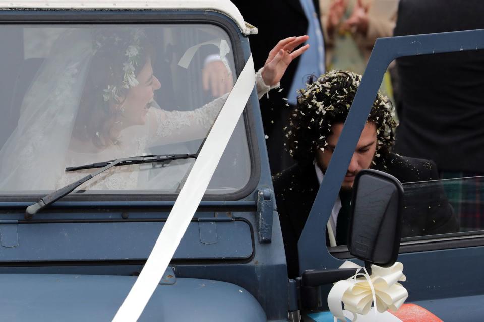 <p>The couple climbed into their wedding car following the ceremony.</p>