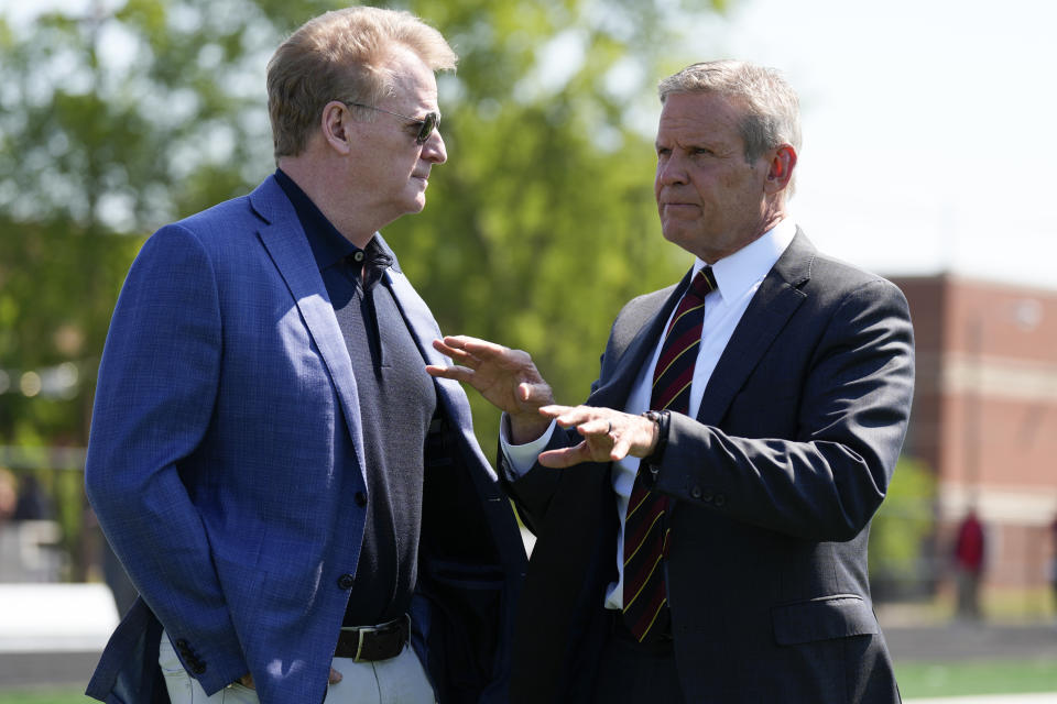 NFL Commissioner Roger Goodell, left and Gov. Bill Lee speak with each other before a bill signing ceremony Tuesday, May 21, 2024, in Nashville, Tenn. Gov. Lee signed a bill requiring all Tennessee high schools to keep an automated external defibrillator available during classes along with all athletic practices and games. (AP Photo/George Walker IV)