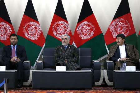 Afghanistan's Chief Executive Abdullah Abdullah, alongside his two vice-presidential candidates Enayatullah Babur Farahmand (L) and Asadullah Saadati (R), arrives to register as a candidate for the upcoming presidential election at the Afghanistan's Independent Election Commission (IEC) in Kabul, Afghanistan January 20, 2019.REUTERS/Omar Sobhani