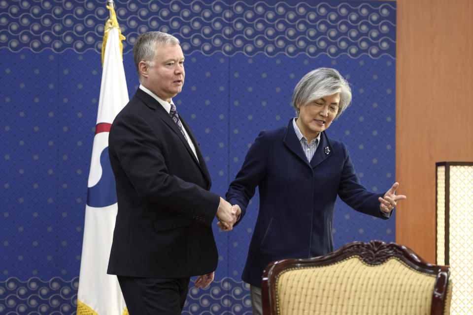 U.S. Special Representative for North Korea Stephen Beigun, left, is escorted by South Korean Foreign Minister Kang Kyung-wha for a photo during their meeting at Foreign Ministry in Seoul Saturday, Feb. 9, 2019. Beigun returned from three days of talks in Pyongyang, North Korea, before the second summit between U.S. President Donald Trump and North Korean leader Kim Jong Un in Vietnam later this month. (Ed Jones/Pool Photo via AP)