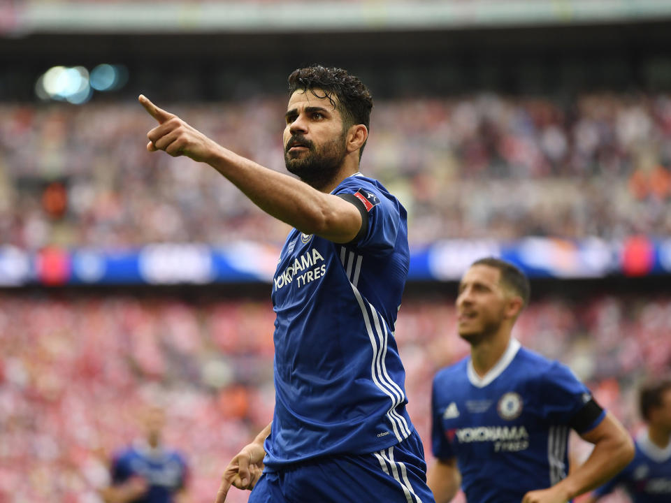 Diego Costa celebrates his equaliser against Arsenal: Getty