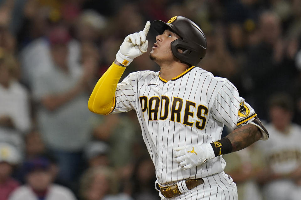 San Diego Padres' Manny Machado reacts after hitting a two-run home run during the third inning of the team's baseball game against the Philadelphia Phillies, Friday, Aug. 20, 2021, in San Diego. (AP Photo/Gregory Bull)