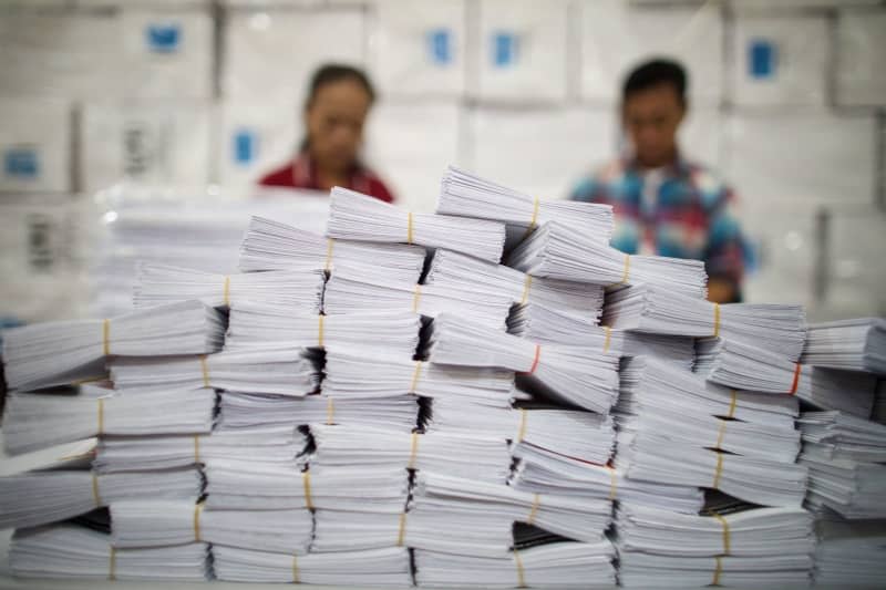 Officials sort ballot papers and boxes in preparation for the Indonesian Presidential elections, at Ware House of Indonesian Election Committee in Tangerang Selatan. Donal Husni/ZUMA Press Wire/dpa