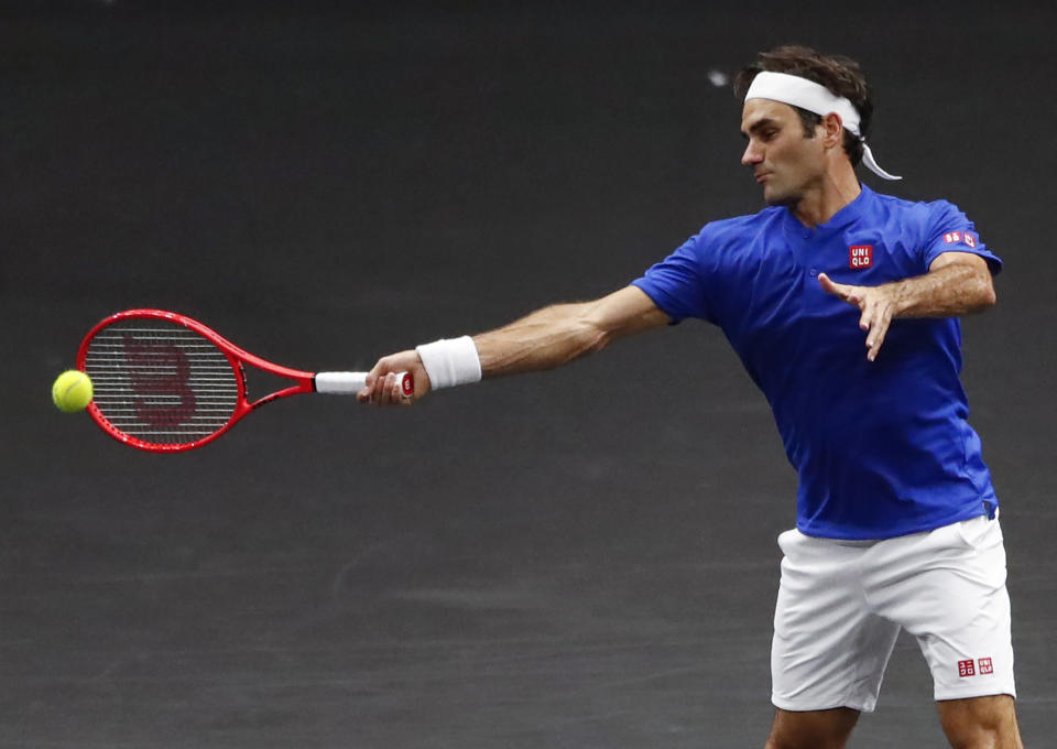 Team Europe's Roger Federer hits a return to Team World's Nick Kyrgios at the Laver Cup tennis event, Saturday, Sept. 22, 2018, in Chicago. (AP Photo/Kamil Krzaczynski)