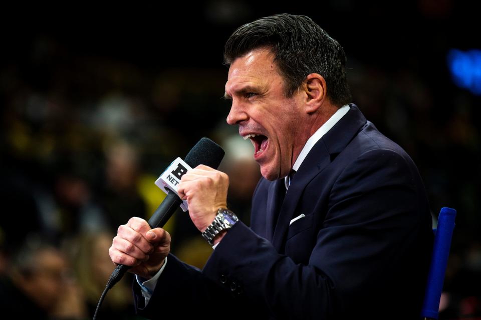 Shane Sparks does commentary during a Cy-Hawk Series NCAA men's wrestling dual between Iowa and Iowa State last month.