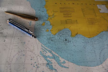 A map with the mark "TKP" (C), believed to indicate the possible location of the wreckage of AirAsia flight QZ8501, is seen onboard SAR ship Purworejo at Kumai port, Pangkalan Bun district, January 1, 2015. REUTERS/Beawiharta