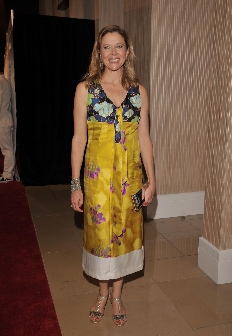 Annette Bening in a yellow floral dress