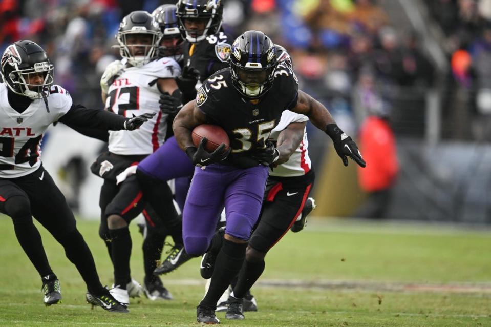 Dec 24, 2022; Baltimore, Maryland, USA; Baltimore Ravens running back Gus Edwards (35) rushes during the game against the Atlanta Falcons at M&T Bank Stadium. Mandatory Credit: Tommy Gilligan-USA TODAY Sports