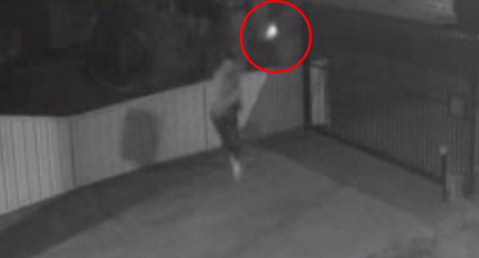 The gunman on June 8 can be seen firing bullets just metres from the target at the Reservoir address.