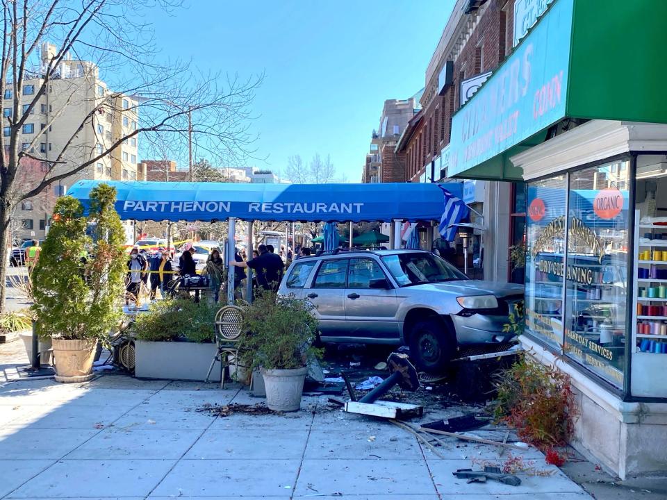An SUV is seen crashed into a storefront in Washington, DC.