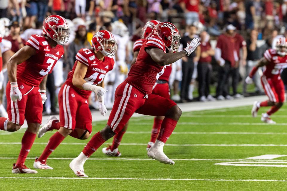 Linebacker Kris Moncrief celebrates after getting a sack  as the Louisiana Ragin Cajuns take on the ULM Warhawks.  Saturday, Nov. 30, 2019.