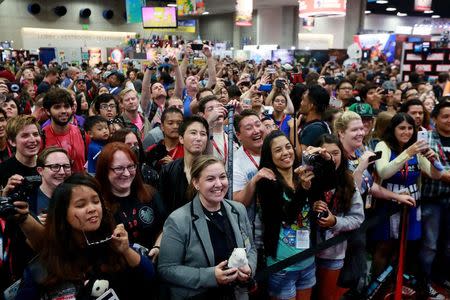 The crowd cheers at an autograph signing session during the 2014 Comic-Con International Convention in San Diego, California July 26, 2014. REUTERS/Sandy Huffaker
