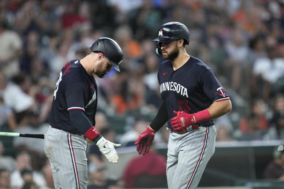 Minnesota Twins' Joey Gallo (13) celebrates his home run with Ryan Jeffers, left, in the seventh inning of a baseball game against the Detroit Tigers, Saturday, June 24, 2023, in Detroit. (AP Photo/Paul Sancya)