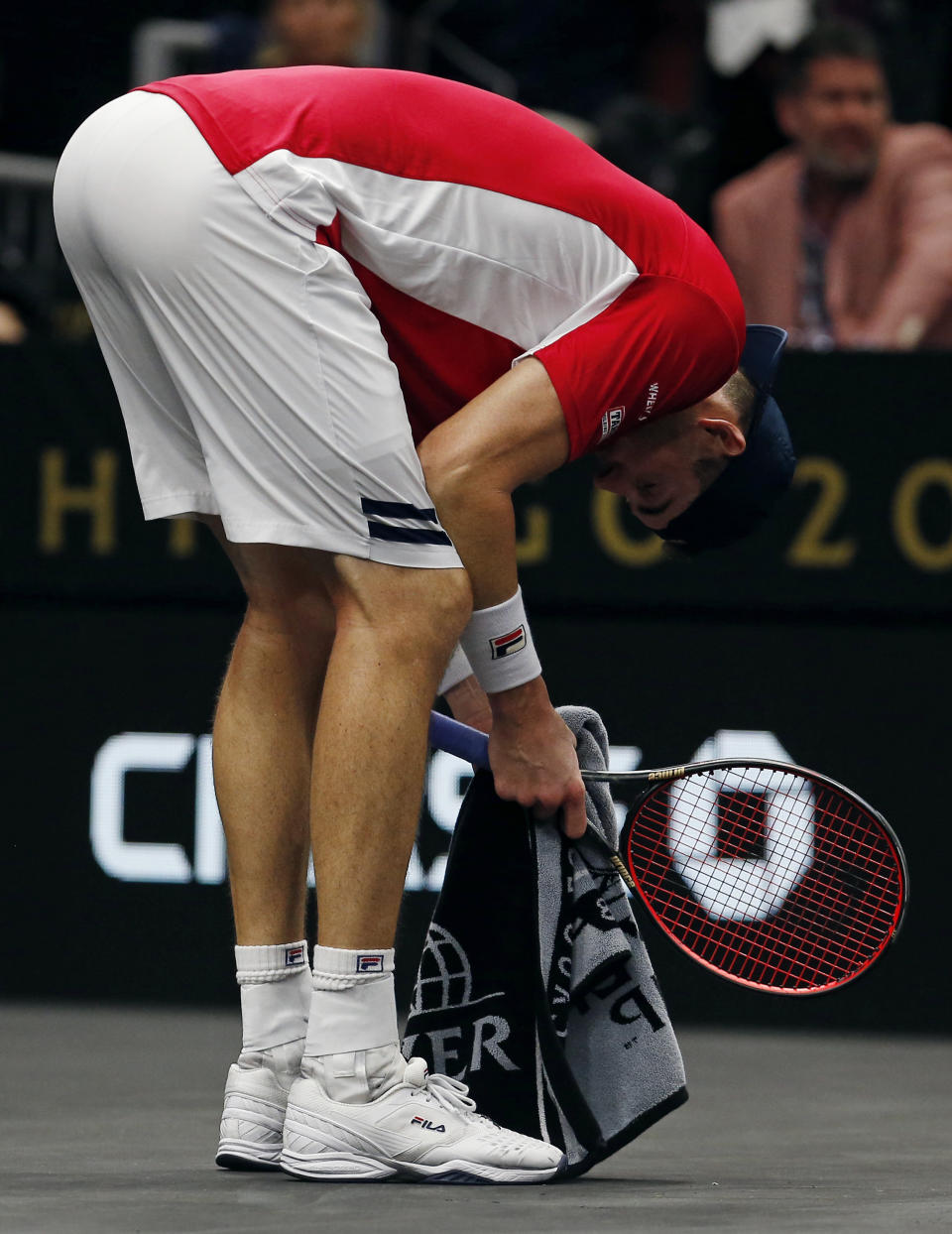 Team World's John Isner reacts during a men's singles tennis match against Team Europe's Roger Federer at the Laver Cup, Sunday, Sept. 23, 2018, in Chicago. (AP Photo/Jim Young)