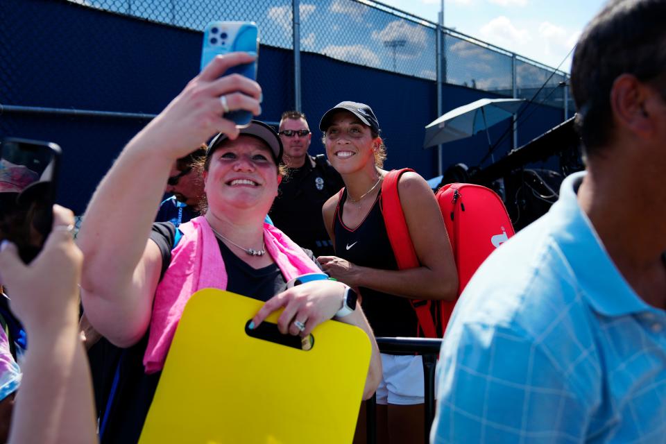 Fans swarm Madison Keys for selfies and autographs after her match against Iga Swiatek at the Western & Southern Open at the Lindner Family Tennis Center in Mason, Ohio, on Thursday, Aug. 18, 2022.