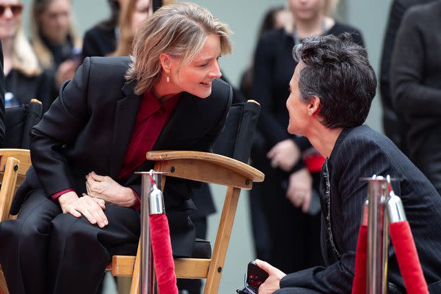 <p>VALERIE MACON/AFP via Getty</p> Jodie Foster and Alexandra Hedison speak to one another during Friday's event