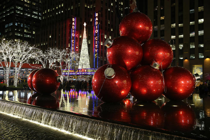 <p>Giant Christmas ornaments rest in the fountain across the street from Radio City Music Hall. (Gordon Donovan/Yahoo News) </p>