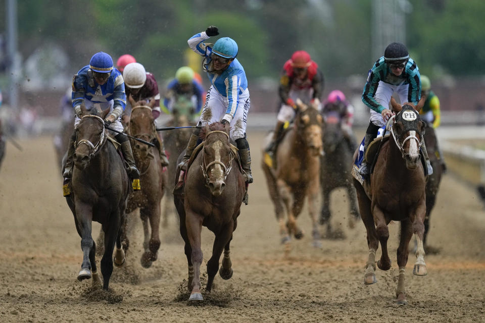 Javier Castellano celebrates after riding Mage to win the 149th running of the Kentucky Derby horse race at Churchill Downs Saturday, May 6, 2023, in Louisville, Ky. (AP Photo/Julio Cortez)