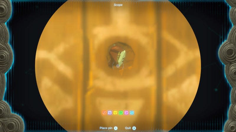 A Yiga Clan member can be seen through a hole in a door.