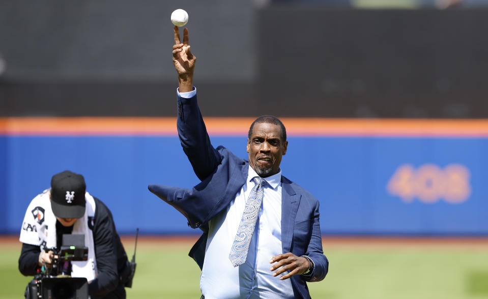 Former New York Mets pitcher Dwight Gooden throws out the ceremonial first pitch before a baseball game against the Kansas City Royals at Citi Field on Sunday, April 14, 2024, in New York. (AP Photo/Noah K. Murray)