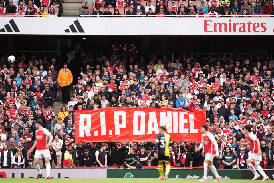 Fans hold up a banner in memory of 14-year-old Daniel Anjorin who died following the sword attack in east London on Tuesday, during the Premier League match at the Emirates Stadium, London. Picture date: Saturday May 4, 2024.