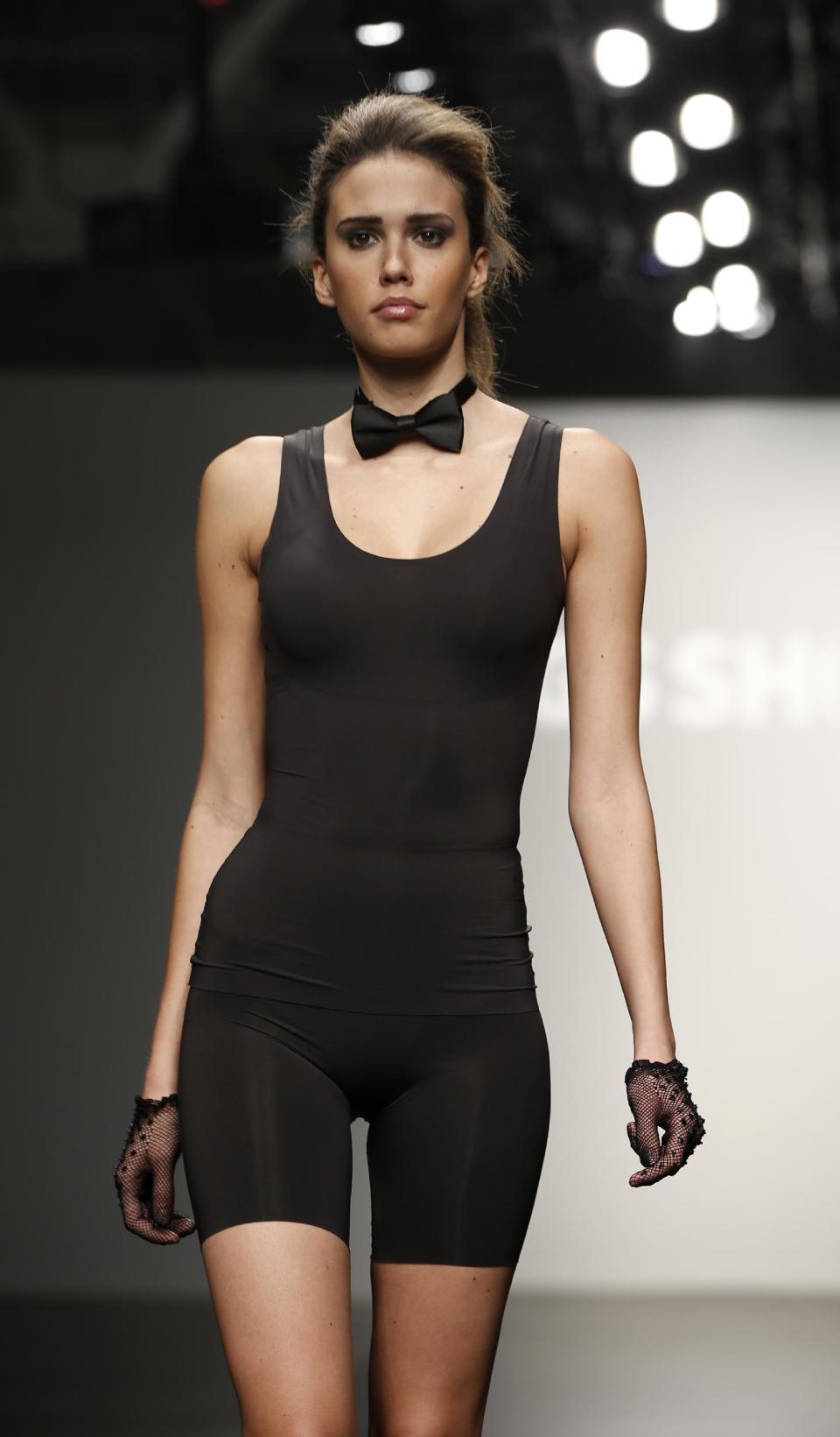 CAPTION CORRECTION, CORRECTS TO REMOVE REFERENCE TO ANNA SUI, WHOSE COLLECTION WAS NOT REPRESENTED AT THIS SHOW - A model walks the runway during the presentation of the GS Shop Lingerie show featuring Spanx, Wonderbra, and Platex during Fashion Week Tuesday, Feb. 4, 2014, in New York. (AP Photo/Kathy Willens)