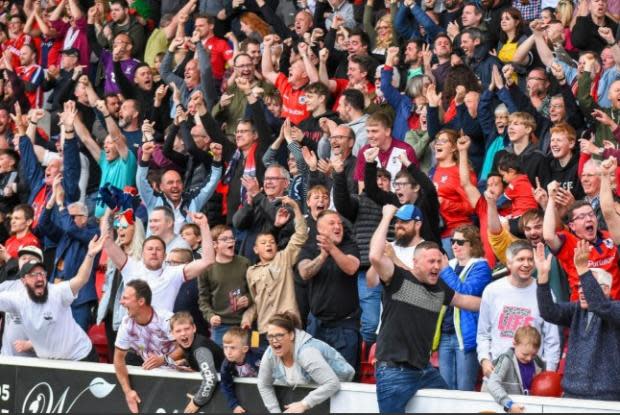 York Press: The York City supporters celebrate Lenell John-Lewis' opener. Picture: Tom Poole