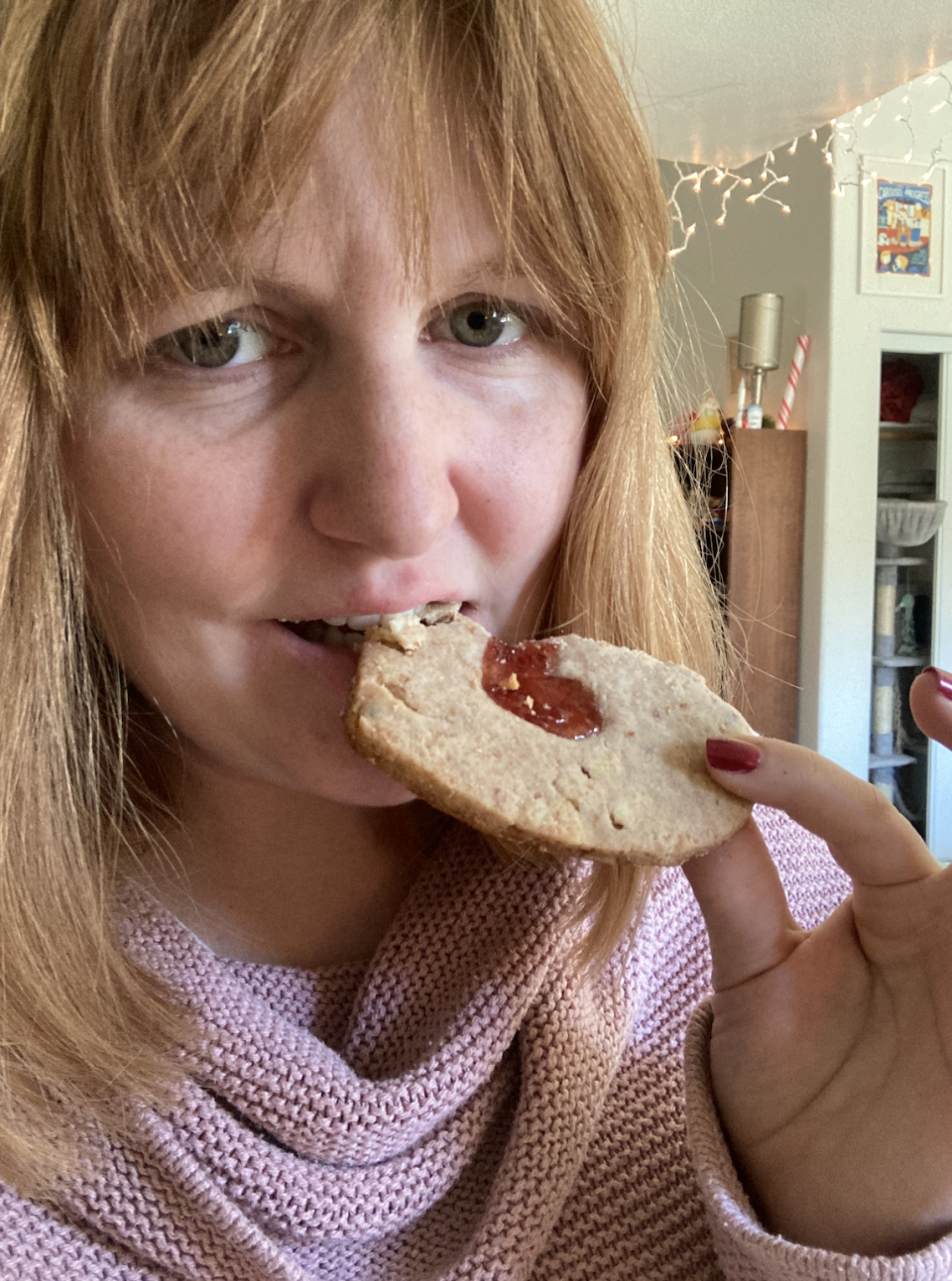 author taking a bite of the cookie