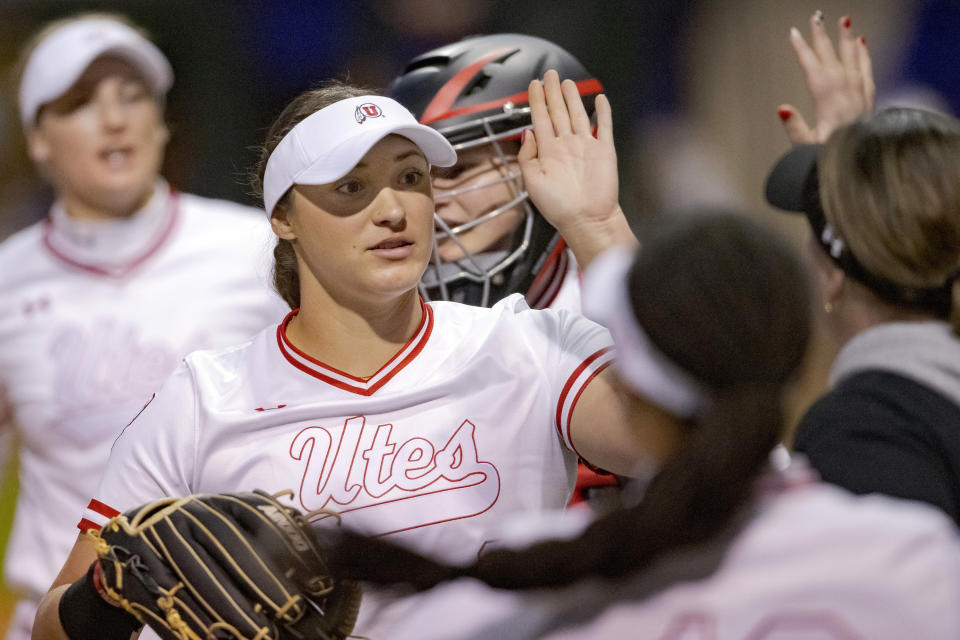 FILE - Utah starting pitcher/relief pitcher Mariah Lopez (8), center, celebrates an out against LSU to end the inning during an NCAA college softball game on Saturday, Feb. 18, 2023, in Baton Rouge, La. (AP Photo/Matthew Hinton, File)