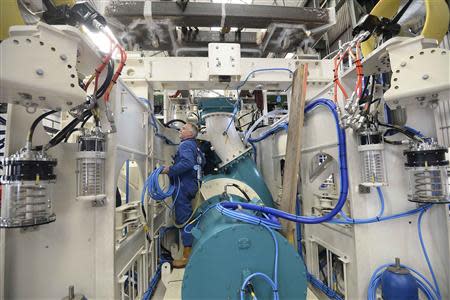 An electrician wires up a subsea mining machine being built by Soil Machine Dynamics (SMD) for Nautilus Minerals at Wallsend, northern England April 14, 2014. REUTERS/ Nigel Roddis