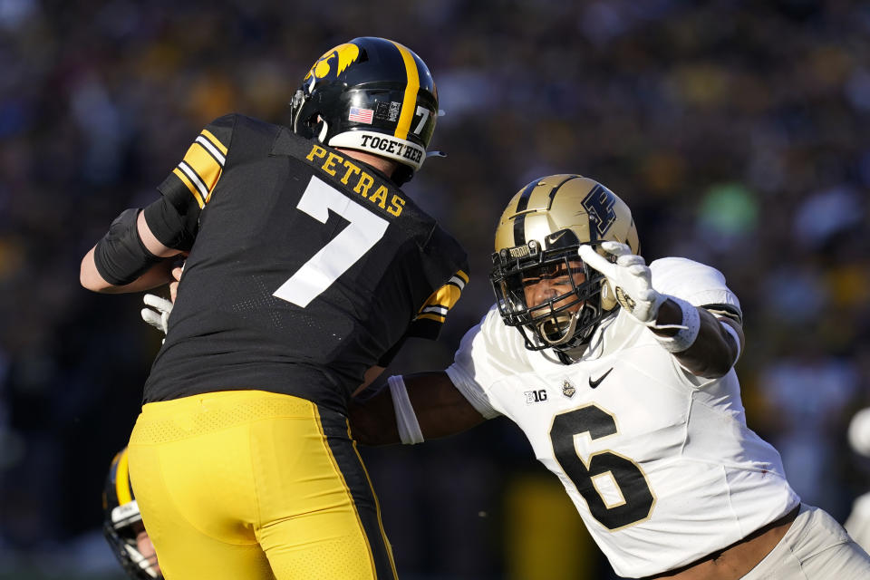 Purdue linebacker Jalen Graham (6) tackles Iowa quarterback Spencer Petras (7) during the second half of an NCAA college football game, Saturday, Oct. 16, 2021, in Iowa City, Iowa. Purdue won 24-7. (AP Photo/Charlie Neibergall)