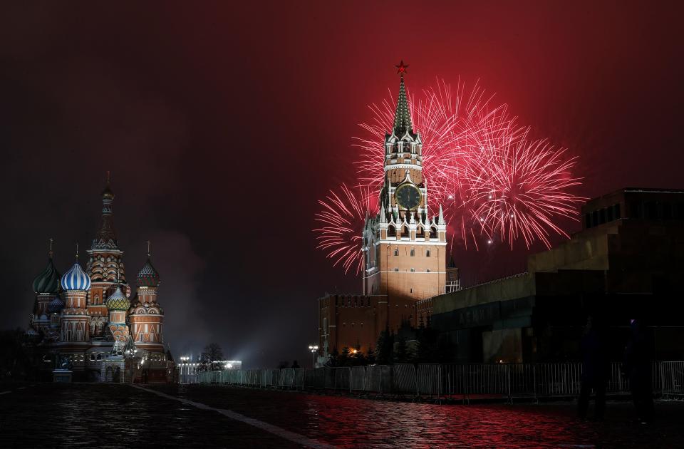 Fireworks explode behind the Kremlin’s Spasskaya Tower near St. Basil’s Cathedral during New Year’s Day celebrations in Moscow, RussiaREUTERS