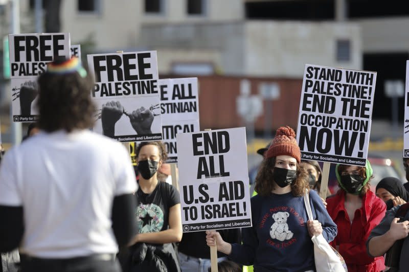 People gather and hold up signs at a "Protect Palestine Rally" at the Texas State Capitol in Austin, Texas, on January 6. Photo by Adam Davis/EPA-EFE