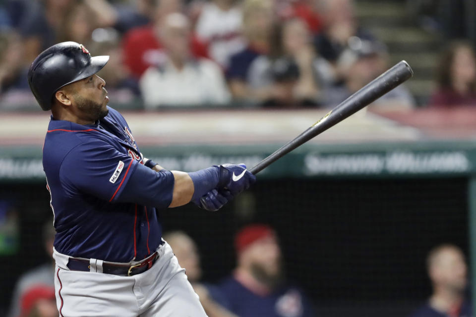 Minnesota Twins' Nelson Cruz watches his ball after hitting a two-run home run in the sixth inning in the second game of a baseball doubleheader against the Cleveland Indians, Saturday, Sept. 14, 2019, in Cleveland. (AP Photo/Tony Dejak)