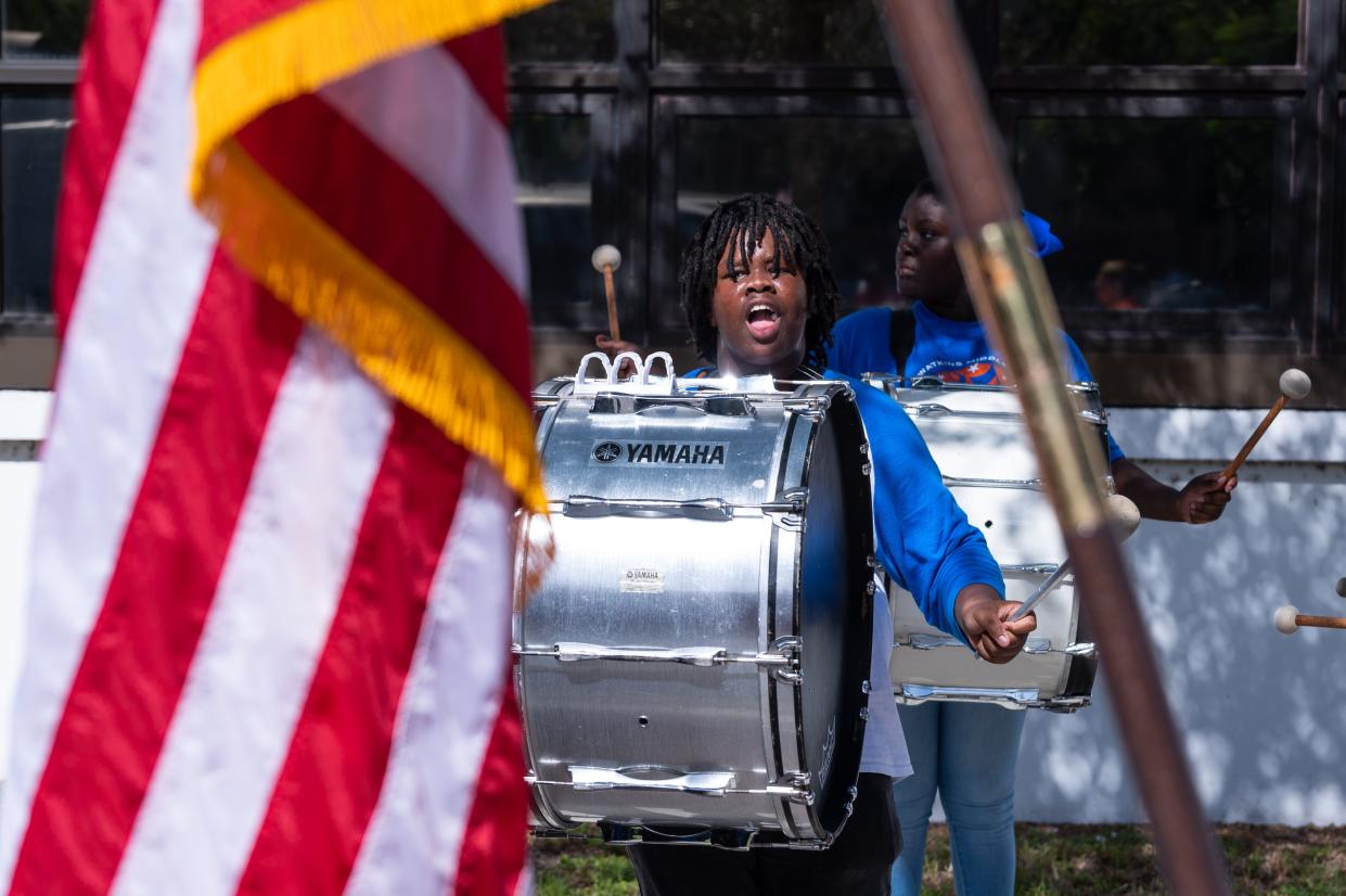 A percussionist in the Howell L. Watkins Middle School Marching Band performs prior to the start of the the Veterans Day Parade in downtown West Palm Beach.
