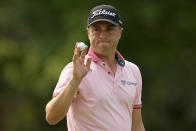 Justin Thomas waves after making a putt on the 14th hole during the final round of the PGA Championship golf tournament at Southern Hills Country Club, Sunday, May 22, 2022, in Tulsa, Okla. (AP Photo/Eric Gay)