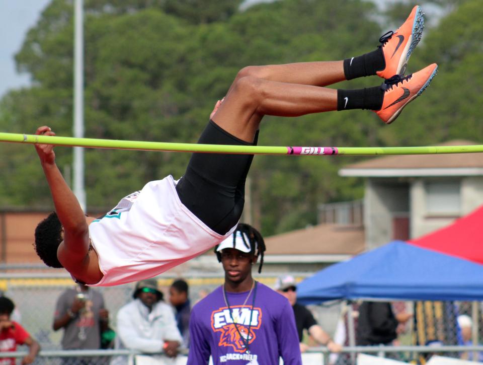 Providence's Omarr Dixon (3574) clears the bar in the boys high jump  at the Bob Hayes Invitational Track Meet on March 19, 2022. [Clayton Freeman/Florida Times-Union]