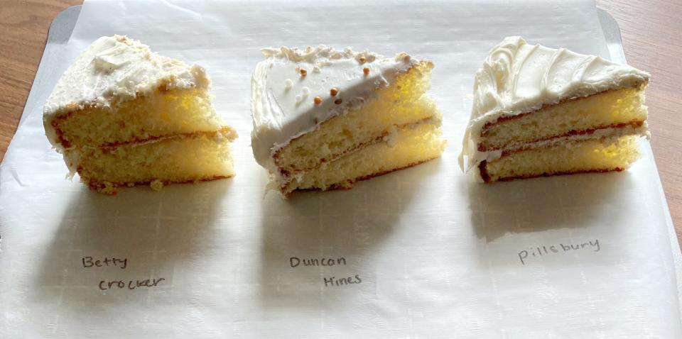 three vanilla cake slices on a piece of white parchment paper