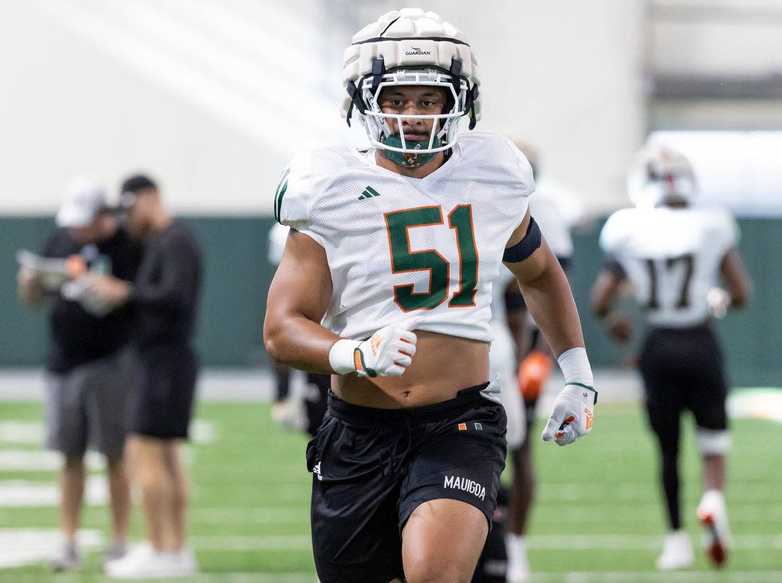 Miami Hurricanes linebacker Francisco Mauigoa (51) warms up during practice at the Carol Soffer Indoor Practice Facility at the University of Miami on Wednesday, August 8, 2023 in Coral Gables, Fla.
