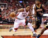 Toronto Raptors guard DeMar DeRozan (10) dribbles away from Indiana Pacers forward Paul George (13) in game seven of the first round of the 2016 NBA Playoffs at Air Canada Centre. Mandatory Credit: Dan Hamilton-USA TODAY Sports