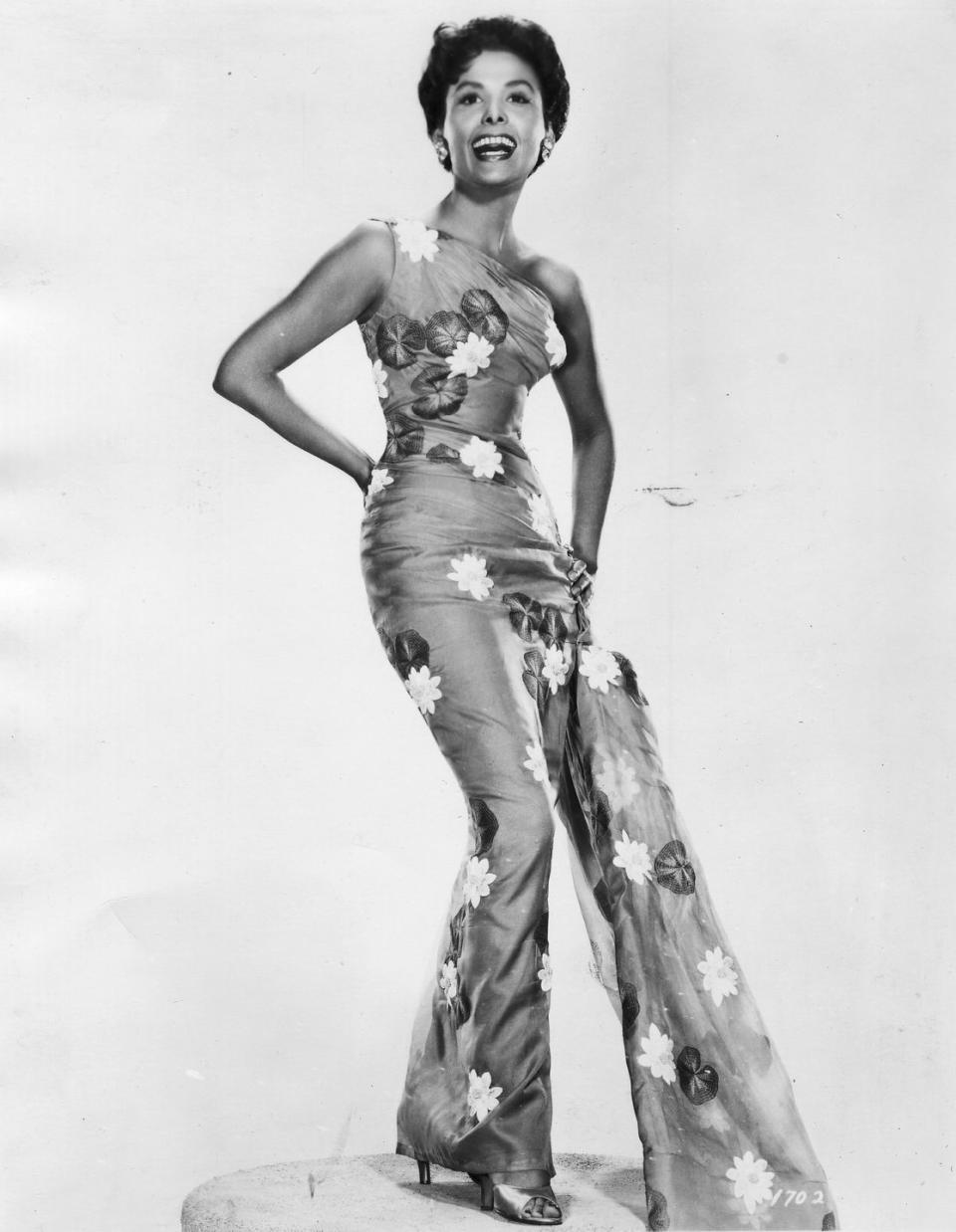 <p>The iconic Lena Horne posing in a floral-appliqué jumpsuit with a one-shouldered neckline. </p>