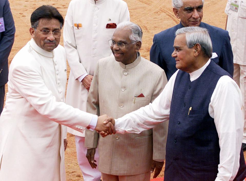 FILE - Then Pakistan President Gen. Pervez Musharraf, left, is greeted by Indian Prime Minister Atal Bihari Vajpayee at the Presidential Palace in New Delhi, India, on July 14, 2001. An official said Sunday, Feb. 5, 2023, Gen. Musharraf, Pakistan military ruler who backed U.S. war in Afghanistan after 9/11, has died. (AP Photo/John McConnico, File)
