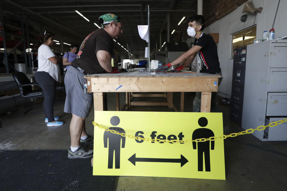 A sign advises social distancing of 6 feet to protect against the coronavirus in Hialeah, Florida. (Photo: ASSOCIATED PRESS)