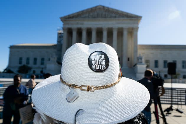 Activists gather outside the Supreme Court for oral arguments in the gerrymandering case Alexander v. South Carolina Conference of the NAACP.