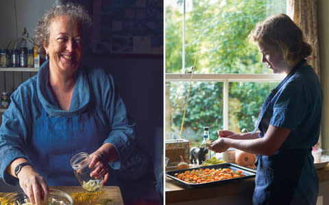 Alison Lea-Wilson and her daughter, Jess, cook with vegetables from the garden and salt made by their company using water from the Menai Strait - Credit: Haarala Hamilton